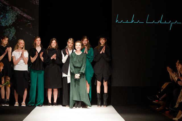 alt=" Fashion Designer  Baiba Ladiga with models at her fashion show Riga Fashion week "