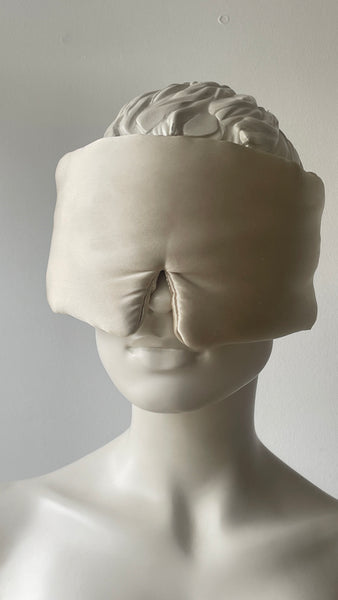 “Eyelash-protecting silk sleep mask in black, made with 22 Momme mulberry silk, shown on a neutral background.”
