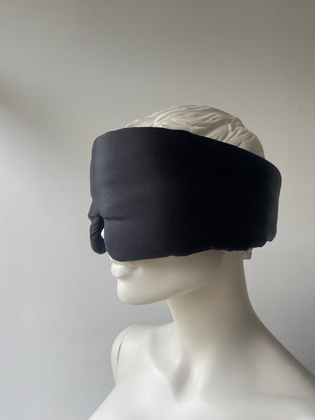 “Eyelash-protecting silk sleep mask in black, made with 22 Momme mulberry silk, shown on a neutral background.”