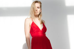 alt="Model wearing red strap cupro dress"